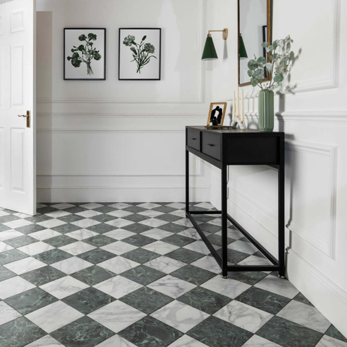 Hallway floor featuring Vitoria Classic green marble-style porcelain chequerboard tiles in a 30 × 30cm format, combining rich green and soft white marble-effect squares laid diagonally, paired with traditional panelling, black console furniture, and botanical décor for a timeless, elegant entrance.