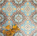 Group of London Streets Hanover Square 20x20cm Victorian Moroccan style porcelain tiles arranged to display the repeating blue, terracotta and cream geometric pattern, styled with autumn leaves for a decorative flat-lay tile setting.