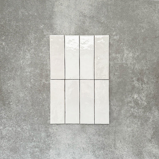 Zellige White brick tiles in a 6.5 × 20cm format, shown in a clean white gloss with subtle surface variation.