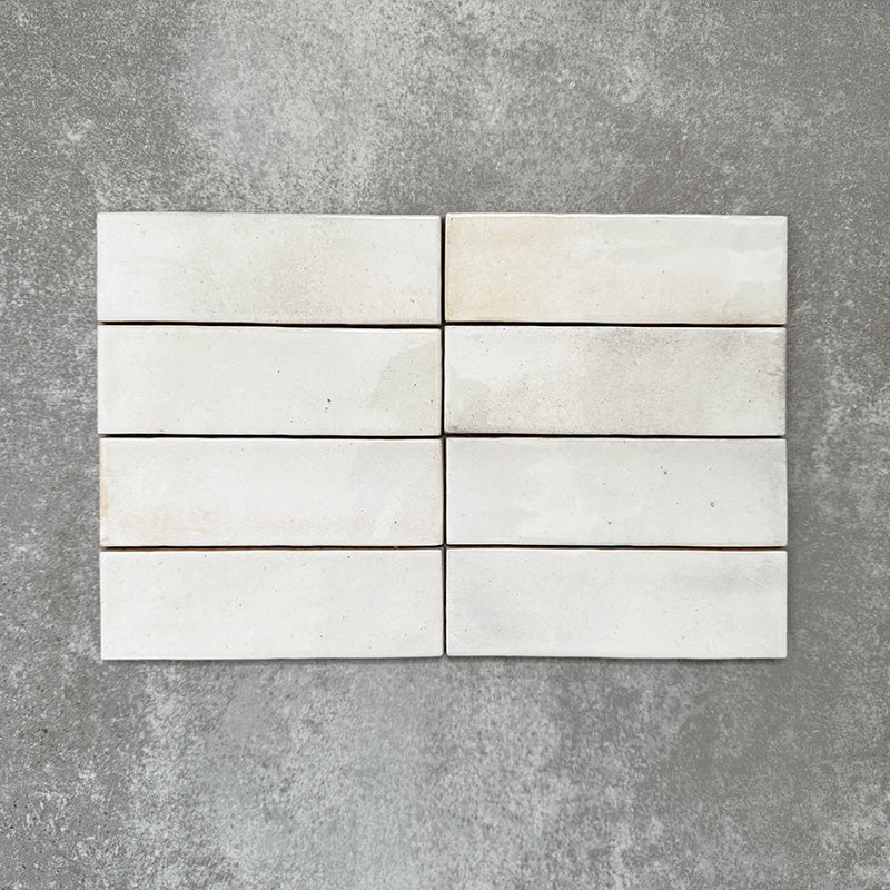Saigon White Brick Wall tiles laid horizontally, featuring Moroccan-style 5.1 × 16.1cm glossy ceramic tiles in soft white tones with subtle tonal variation.