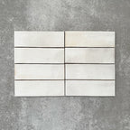 Saigon White Brick Wall tiles laid horizontally, featuring Moroccan-style 5.1 × 16.1cm glossy ceramic tiles in soft white tones with subtle tonal variation.