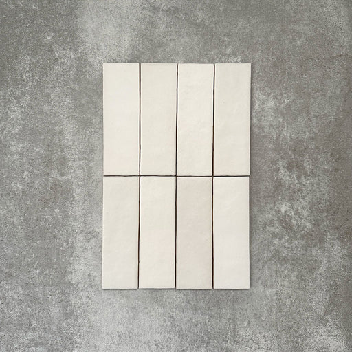 Zellige Chalk White Moroccan-style brick tiles in a 6.5 × 20cm format, showing a soft chalky white glaze with subtle handmade surface variation.