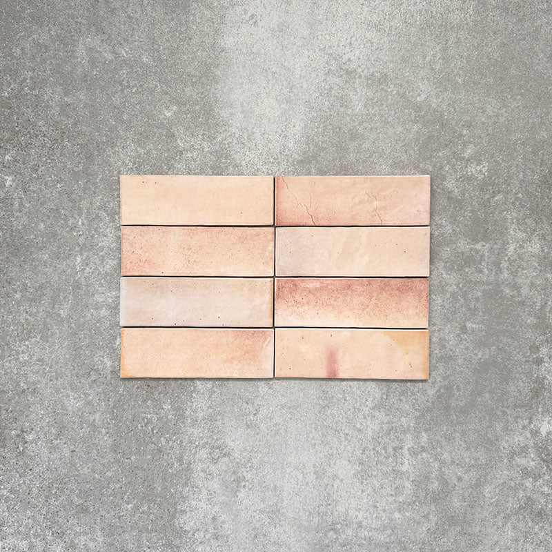 Saigon Rose Pink Brick Wall tiles laid horizontally, featuring Moroccan-style 5.1 × 16.1cm glossy ceramic tiles in soft blush and rose tones with natural colour variation.