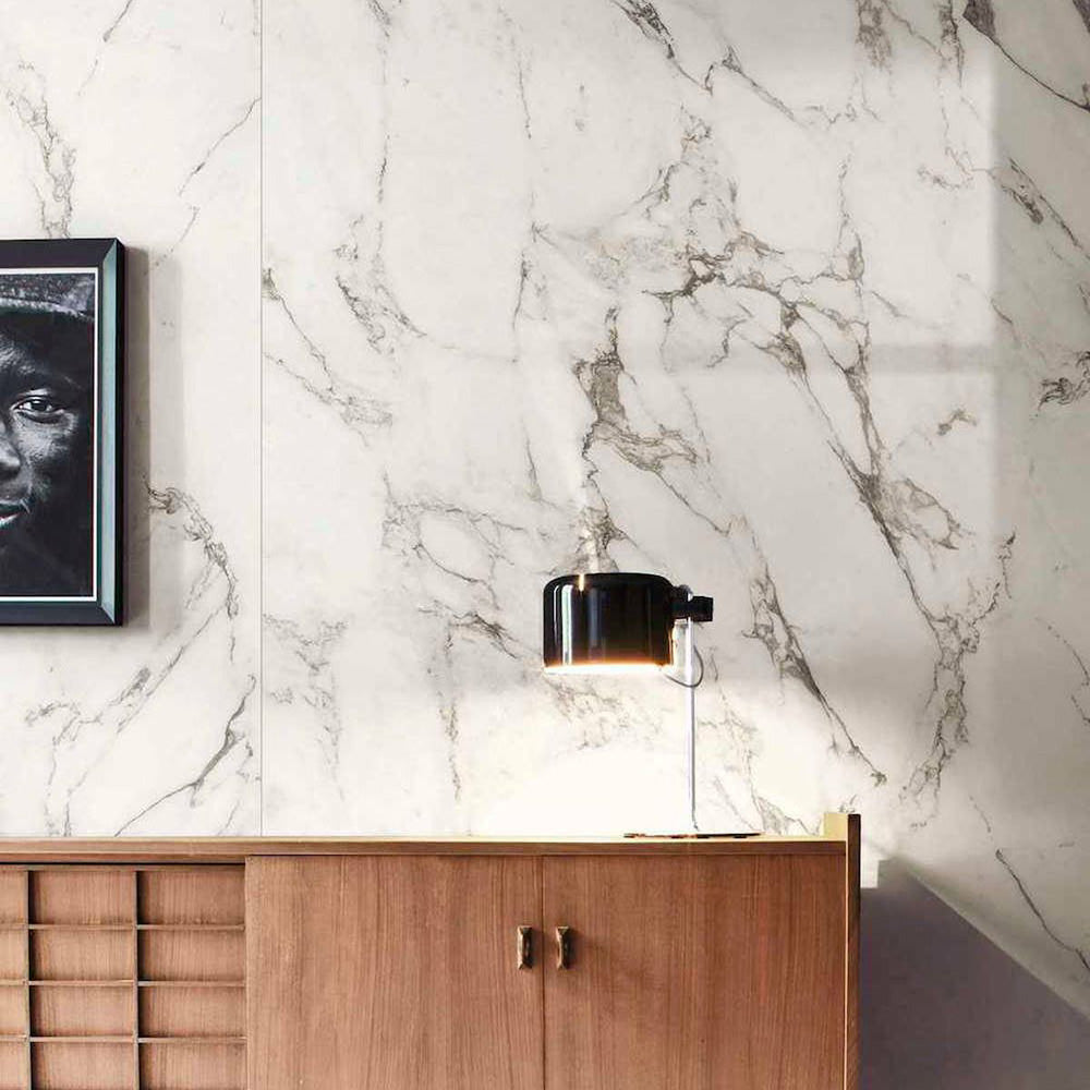 Interior detail featuring Hudson Calacatta Matt Marble 60 × 60cm porcelain wall tiles, showcasing a crisp white base with fine grey veining, paired with warm wood cabinetry and soft lighting to create a balanced, contemporary contrast.