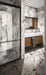 Bathroom interior featuring Hudson Capraia Matt Marble 60 × 120cm porcelain wall tiles, showcasing a crisp white base with bold, dramatic grey veining, paired with black-framed shower detailing and warm wood cabinetry for a striking, contemporary contrast.