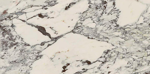 Flat lay of Hudson Capraia Matt Marble 60 × 120cm porcelain tiles, showcasing a crisp white base with bold, sweeping grey veining and deeper tonal accents, creating a dramatic marble effect ideal for statement walls and floors.