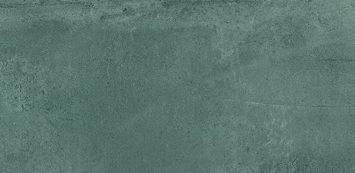 Close-up of Iron Emerald Green Oxide Metallic 30 × 60cm porcelain tile, highlighting rich green tones with subtle tonal variation, a softly textured surface, and a refined metallic effect that adds depth and character to contemporary interiors.