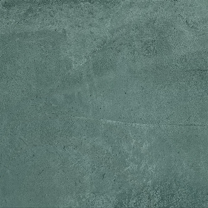 Close-up of Iron Emerald Green Oxide Metallic 80 × 80cm porcelain tile, showcasing deep green tones with soft tonal variation, a gently textured surface, and a subtle metallic effect that brings depth and a contemporary, industrial-inspired finish to interior spaces.