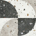 Flat lay of Jericho Decor Terrazzo 66 × 66cm porcelain wall and floor tile, featuring a terrazzo base with multicoloured aggregate chips combined with bold geometric quarter-circle patterning in contrasting light and dark tones, creating a striking, contemporary statement design.