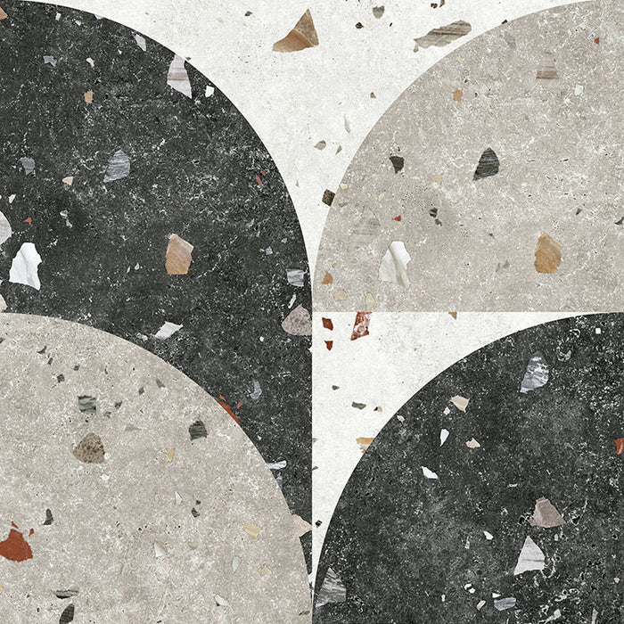 Flat lay of Jericho Decor Terrazzo 66 × 66cm porcelain wall and floor tile, featuring a terrazzo base with multicoloured aggregate chips combined with bold geometric quarter-circle patterning in contrasting light and dark tones, creating a striking, contemporary statement design.