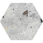 Flat lay of Jericho Silver Terrazzo Hexagon 25 × 22cm porcelain wall and floor tile, featuring a soft grey base with subtle multicoloured aggregate fragments, creating a refined terrazzo effect with gentle texture and understated movement.