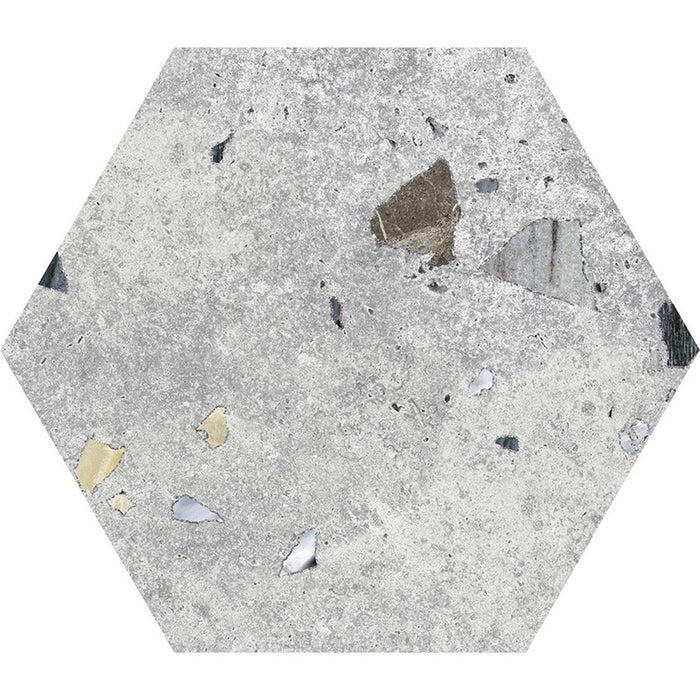 Flat lay of Jericho Silver Terrazzo Hexagon 25 × 22cm porcelain wall and floor tile, featuring a soft grey base with subtle multicoloured aggregate fragments, creating a refined terrazzo effect with gentle texture and understated movement.