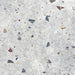 Flat lay of Jericho Silver Terrazzo 66 × 66cm porcelain wall and floor tile, featuring a soft grey base with scattered multicoloured aggregate chips in varied sizes, creating a balanced, contemporary terrazzo effect with subtle movement and texture.
