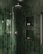 Walk-in shower featuring Jumairah Pine Forest Green 5 × 40cm gloss ceramic wall tiles, laid vertically with deep green tonal variation, paired with chrome shower fittings, recessed niches, and a clean, modern layout.
