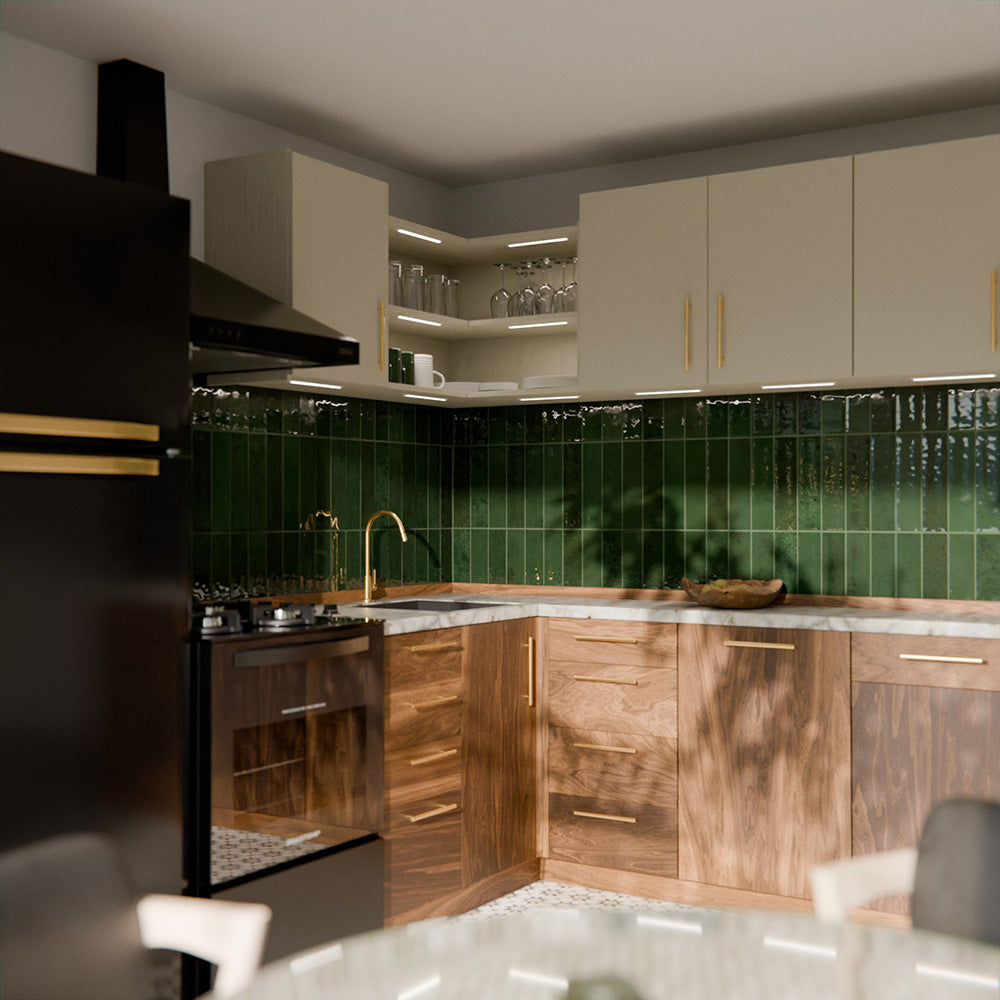 Gloss moss green Nairobi handmade-effect tiles shown in a kitchen setting, highlighting the rich colour depth and lightly textured glazed surface alongside natural wood units and brass details.