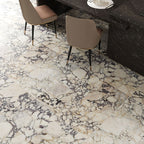 Kitchen interior featuring Fayrouz Picasso 30.5x61cm natural marble tiles with a honed finish, installed across the floor to showcase a white base with bold grey, green and warm gold veining, creating a striking, high-impact surface with rich natural variation.