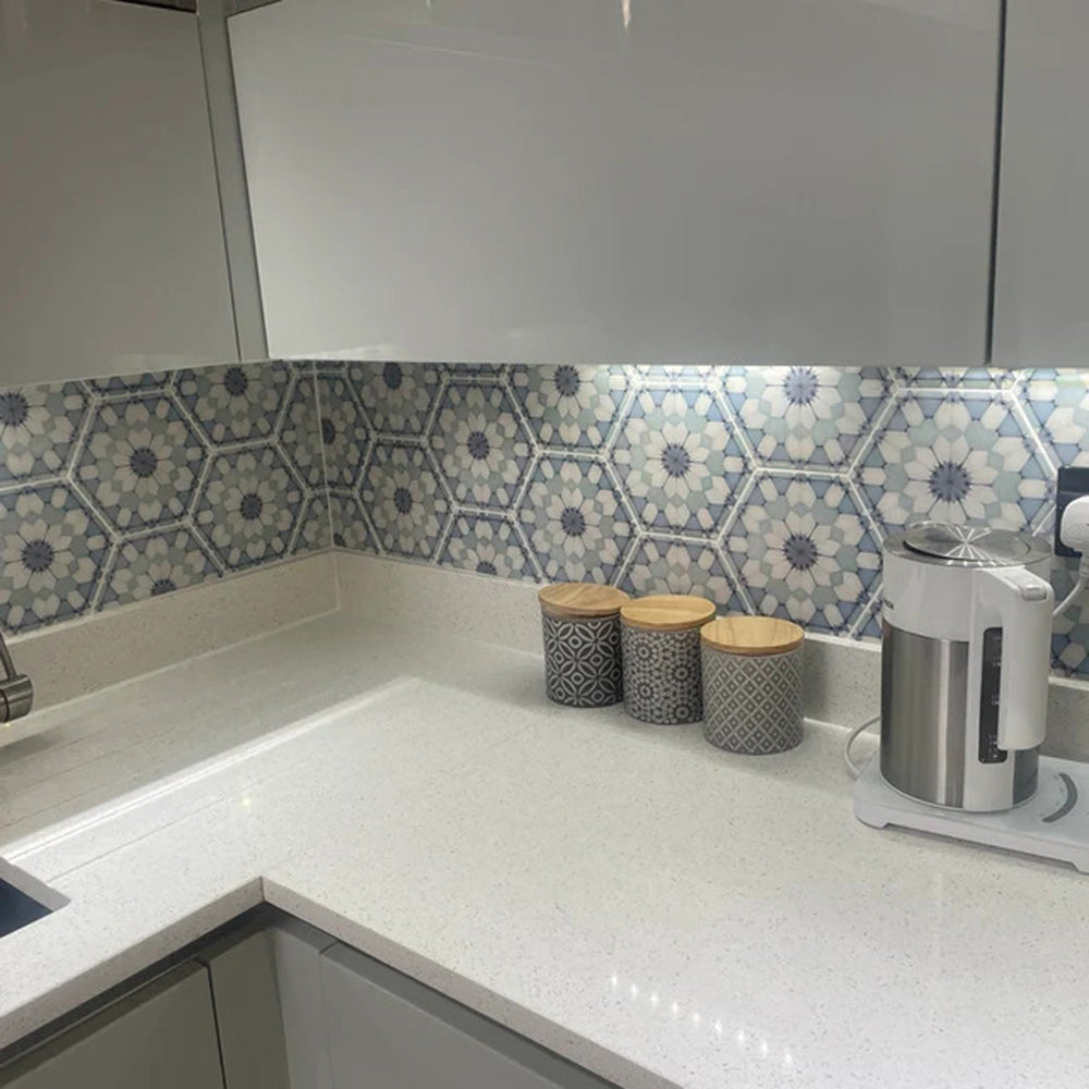 Kitchen splashback featuring Medina Frost Blue Moroccan-style hexagon porcelain tiles, 18.7 × 21.6 cm, arranged in a repeating geometric pattern that adds subtle colour and interest to the space.