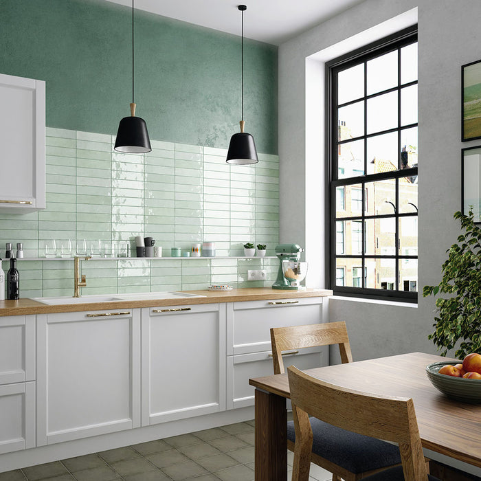 Kitchen featuring Nomad Mint Green brick wall tiles in a 6 × 24.6cm format, used as a splashback to add a fresh, industrial-inspired look.