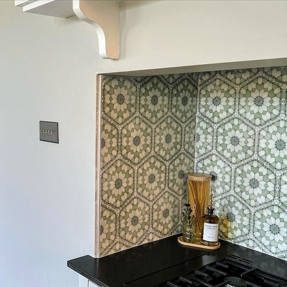 Kitchen splashback featuring Medina Soft Green Moroccan-style hexagon porcelain tiles, 18.7 × 21.6 cm, with an intricate geometric pattern that adds subtle colour and texture to the space.