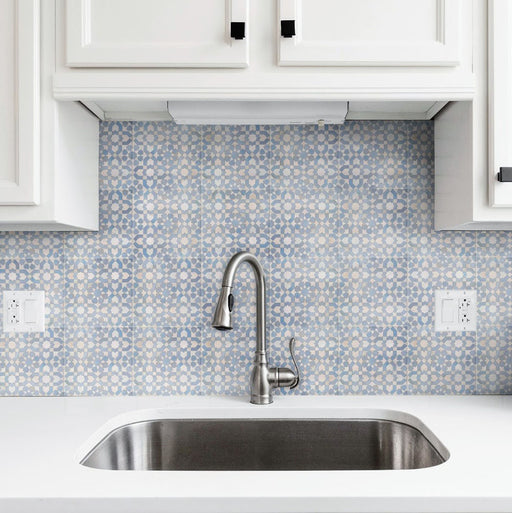 Kitchen splashback featuring Berber Tetuan Blue 15×15cm Moroccan-style porcelain tiles, showcasing a soft blue geometric pattern styled with white cabinets.