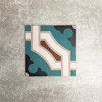 Single London Streets Leicester Square 20x20cm Victorian Moroccan style porcelain tile displayed in a product setting, featuring a geometric pattern in teal, cream and terracotta tones inspired by traditional decorative Victorian style floor tiles.