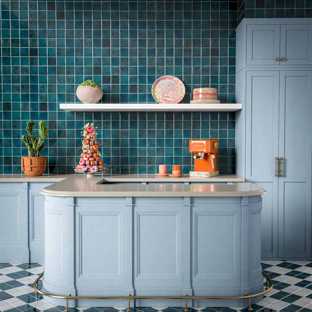 Kitchen featuring Levent Antique White Square 10cm x 10cm gloss porcelain wall and floor tiles in a classic chequerboard design, combining glossy antique white and deep teal squares with subtle shade variation, brass handrail and traditional architectural details.