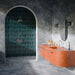 Bathroom featuring Levent Blue Fluted Decor 6cm x 24cm gloss porcelain tiles in the shower, showcasing deep blue tones and a textured fluted surface, paired with blue-grey wall and floor tiles and a statement terracotta basin.