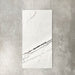Fayrouz Lilac 30.5x61cm natural marble tiles with a honed finish, featuring a soft white base with subtle lilac undertones and fine grey veining, shown as a single tile sample against a neutral textured backdrop.