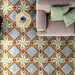 Living room interior featuring Cuba Star Moroccan-style porcelain floor tiles in a 20×20cm square format, displaying a bold geometric star pattern in soft green, blue, pink and mustard tones, styled with a neutral sofa and pastel cushions to create a bright, contemporary space with vintage character.