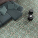 Living room interior featuring London Streets Regent Street 20x20cm Victorian Moroccan style floor tiles, styled with a modern sofa, soft cushions and round black side tables, showcasing an elegant green and cream patterned floor.