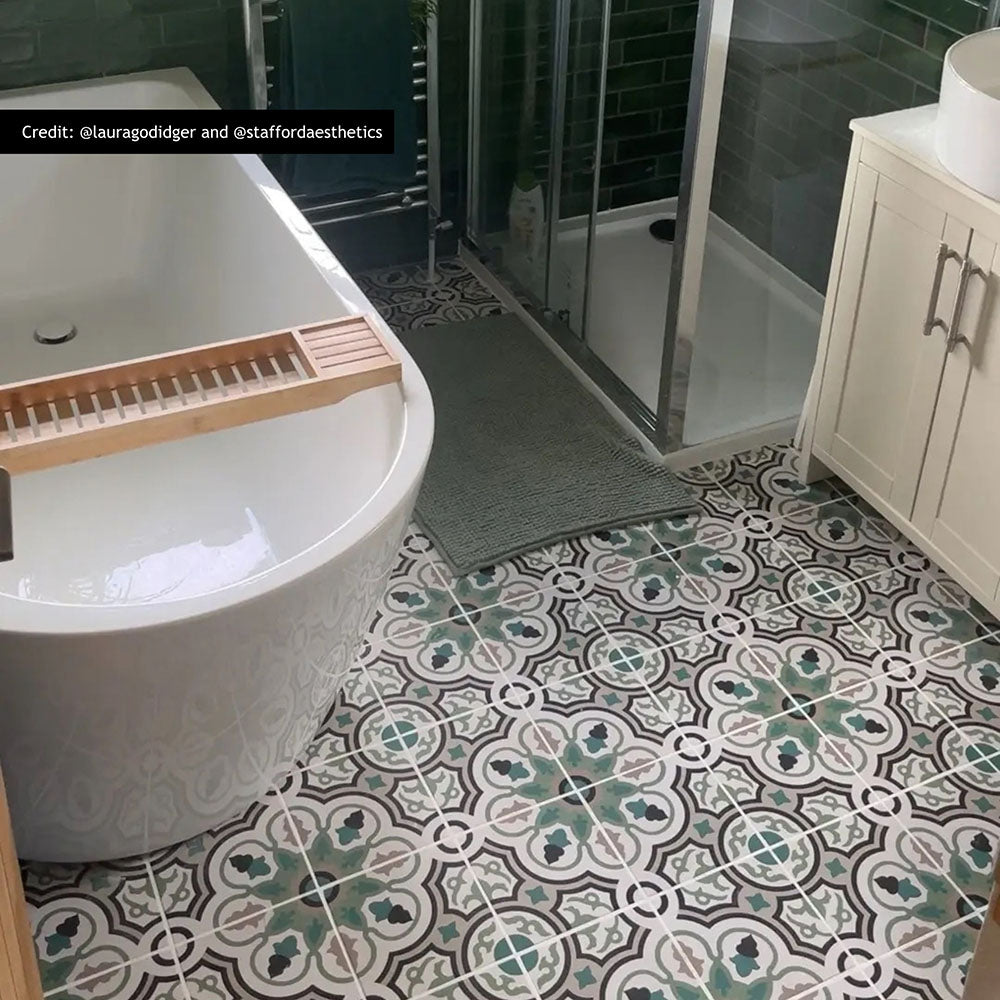 London Streets Bond Street 20cm x 20cm Victorian and Moroccan style tiles, featuring an intricate green, black and neutral pattern across this characterful bathroom floor.