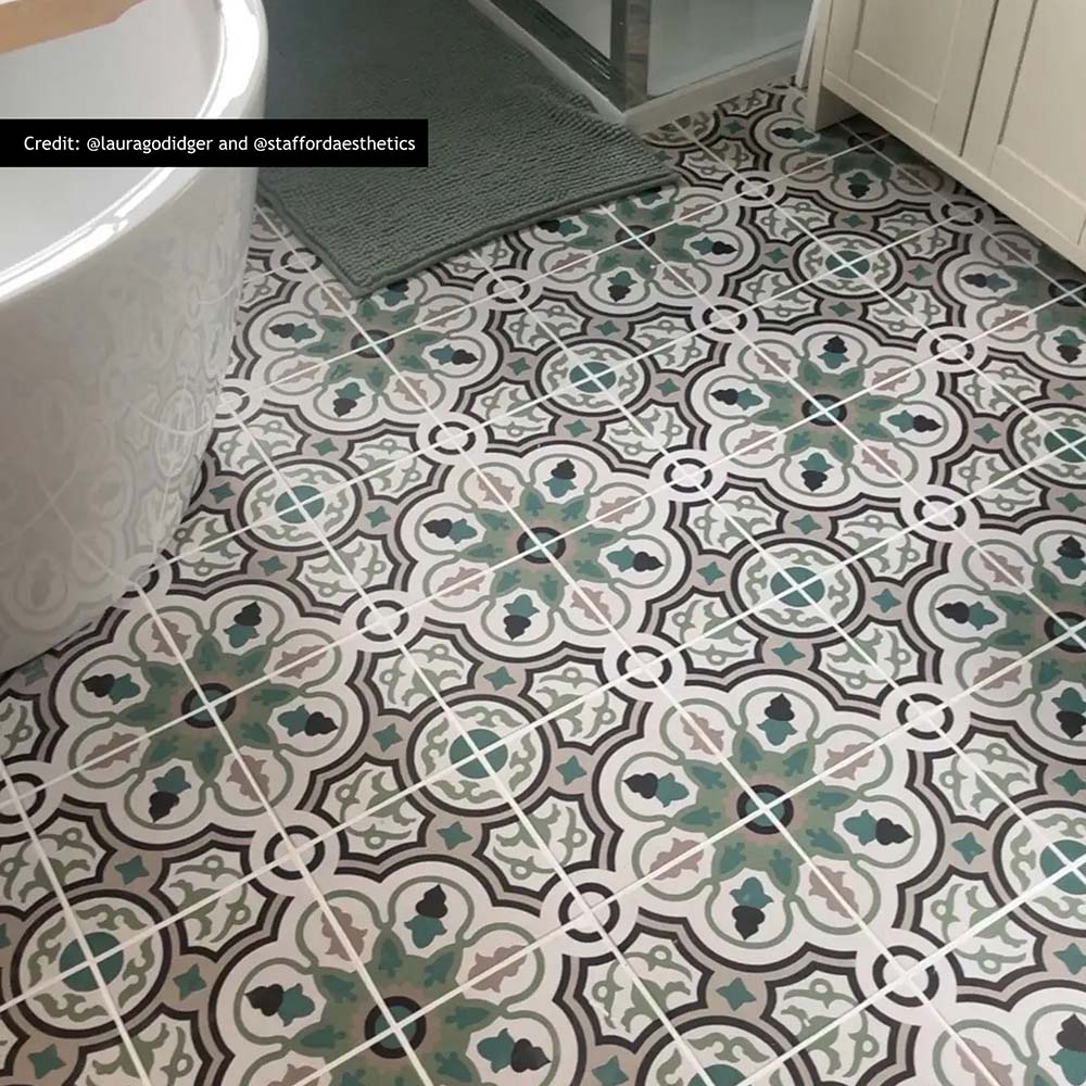 London Streets Bond Street 20cm x 20cm Victorian and Moroccan style tiles, featuring an intricate green, black and neutral pattern across this characterful bathroom floor.