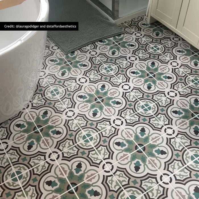 London Streets Bond Street 20cm x 20cm Victorian and Moroccan style tiles, featuring an intricate green, black and neutral pattern across this characterful bathroom floor.