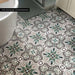London Streets Bond Street 20cm x 20cm Victorian and Moroccan style tiles, featuring an intricate green, black and neutral pattern across this characterful bathroom floor.