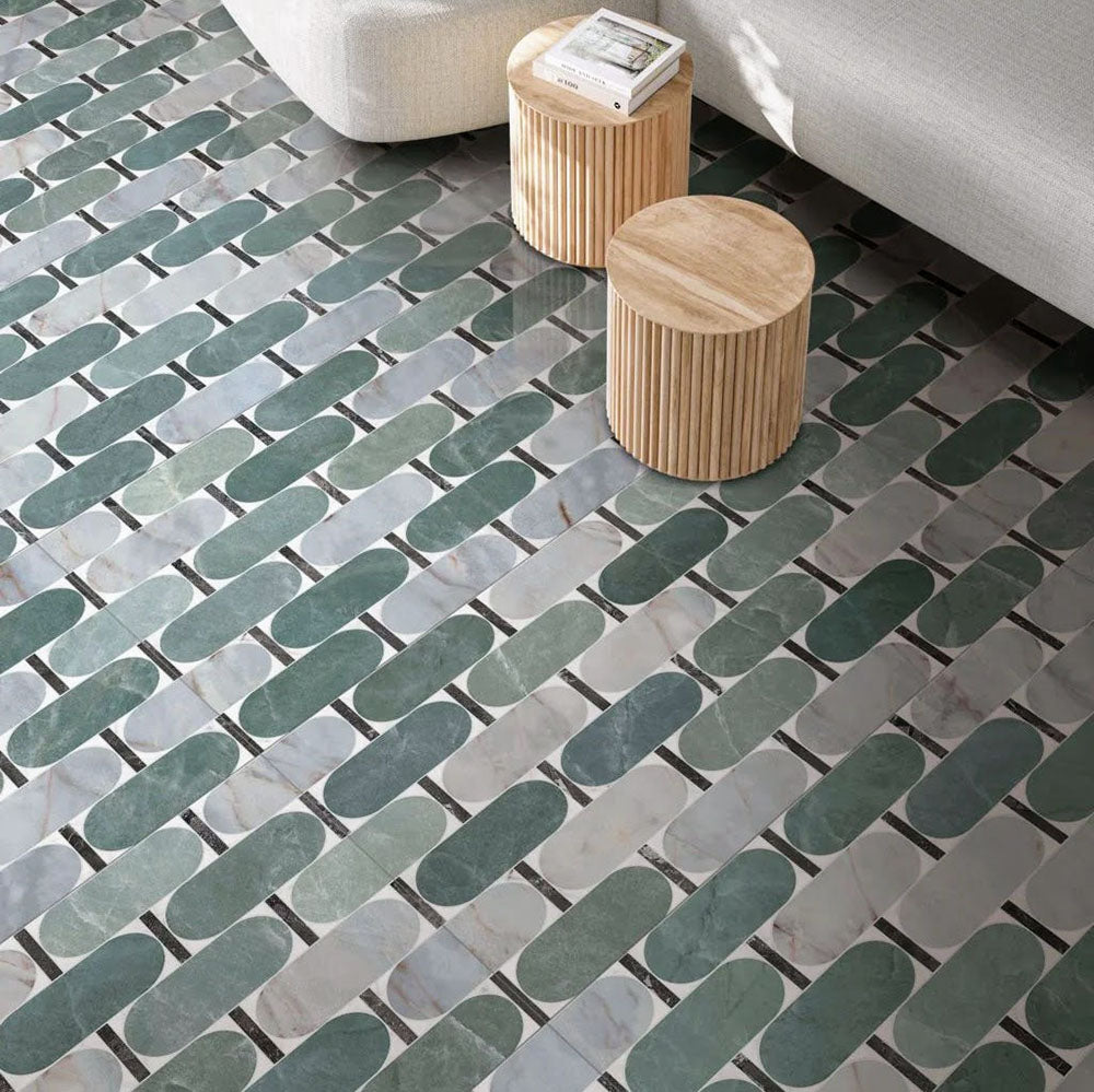 Living area featuring Lucca Abacus 3D Décor 60 × 120cm porcelain floor tiles, showcasing an elongated geometric pattern in soft green, grey, and marble-effect tones with contemporary wood furniture and neutral interiors.