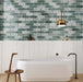 Contemporary bathroom featuring Lucca Abacus 3D Décor 60 × 120cm porcelain wall tiles, showcasing an elongated geometric pattern in soft green and marble-effect tones, paired with warm wood details and modern fittings.