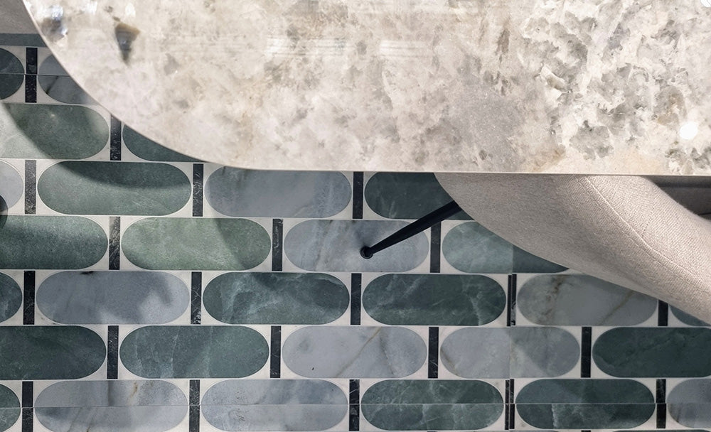 Close-up of Lucca Abacus 3D Décor 60 × 120cm porcelain wall and floor tiles, showcasing an elongated geometric pattern in soft green and marble-effect tones with a bold contemporary decorative finish.