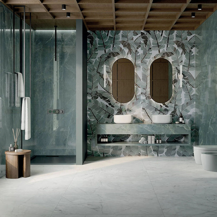 Luxury bathroom featuring Lucca Bali 3D Décor 60 × 120cm porcelain wall tiles, showcasing layered tropical leaf patterns in soft green tones, paired with marble-effect surfaces and contemporary spa-inspired interiors.