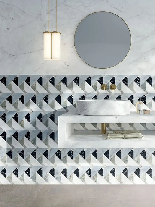 Bathroom interior featuring Lucca Diamond Tips 3D Décor 60 × 120cm porcelain wall and floor tiles, styled as a geometric feature wall with marble-effect surfaces, brass fittings, a floating vanity unit, and a round statement mirror for a refined contemporary finish.