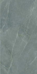 Flat lay of Lucca Ocean Green Natural Matt 60 × 120cm porcelain wall and floor tile, showcasing soft green marble-effect shading with subtle natural veining and a refined stone-inspired matt surface finish.