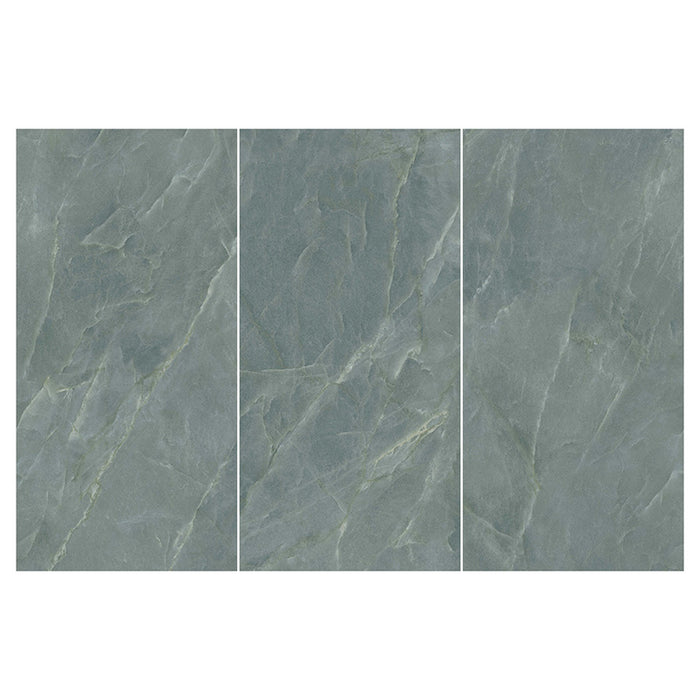Flat lay of Lucca Ocean Green Natural Matt 60 × 120cm porcelain wall and floor tiles, featuring soft green marble-effect tones with subtle natural veining and a refined stone-inspired matt finish.