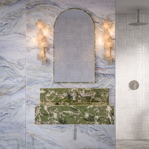 Luxury bathroom featuring Lucca Quartz Lux 3D 60 × 120cm porcelain wall and floor tiles, styled with flowing marble-effect veining, green stone vanity details, textured white wall tiles, and elegant contemporary finishes.
