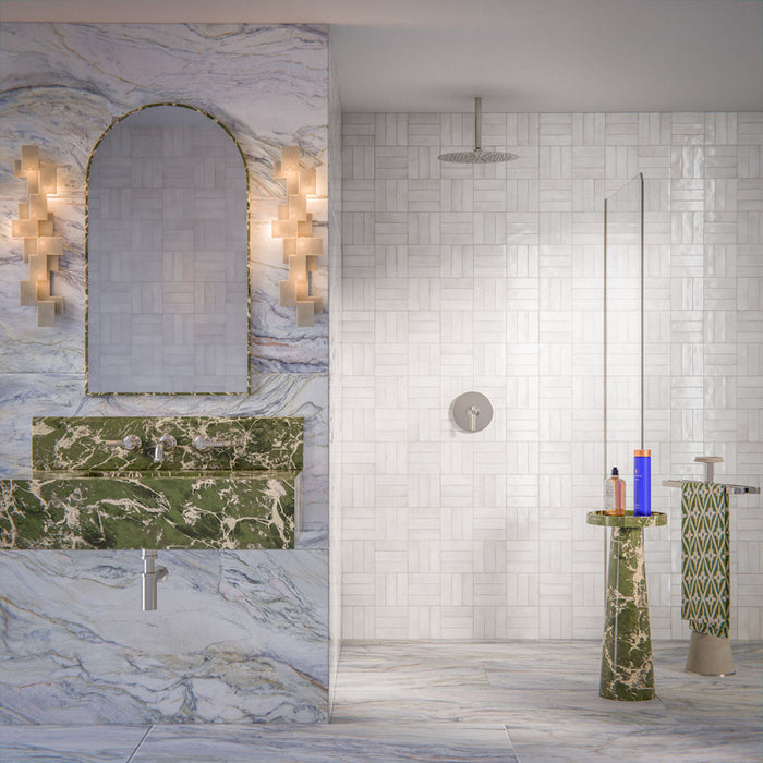 Luxury bathroom featuring Lucca Quartz Lux 3D 60 × 120cm porcelain wall and floor tiles, styled with flowing marble-effect veining, green stone vanity details, textured white wall tiles, and elegant contemporary finishes.