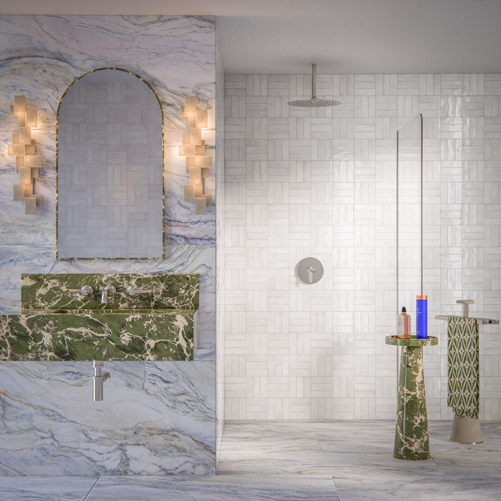 Luxury bathroom featuring Lucca Quartz Matt 60 × 120cm porcelain wall and floor tiles, styled with soft marble-effect veining, green stone vanity details, textured white wall tiles, and elegant contemporary finishes.