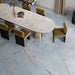 Dining area featuring Lucca River Blue Lux 3D 60 × 120cm porcelain wall and floor tiles, styled with soft blue marble-effect tones, warm veining, velvet dining chairs, and contemporary neutral interiors.