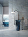 Luxury bathroom featuring Lucca River Blue Lux 3D 60 × 120cm porcelain wall and floor tiles, styled with soft blue marble-effect veining, black fittings, sculptural blue basins, and contemporary spa-inspired interiors.