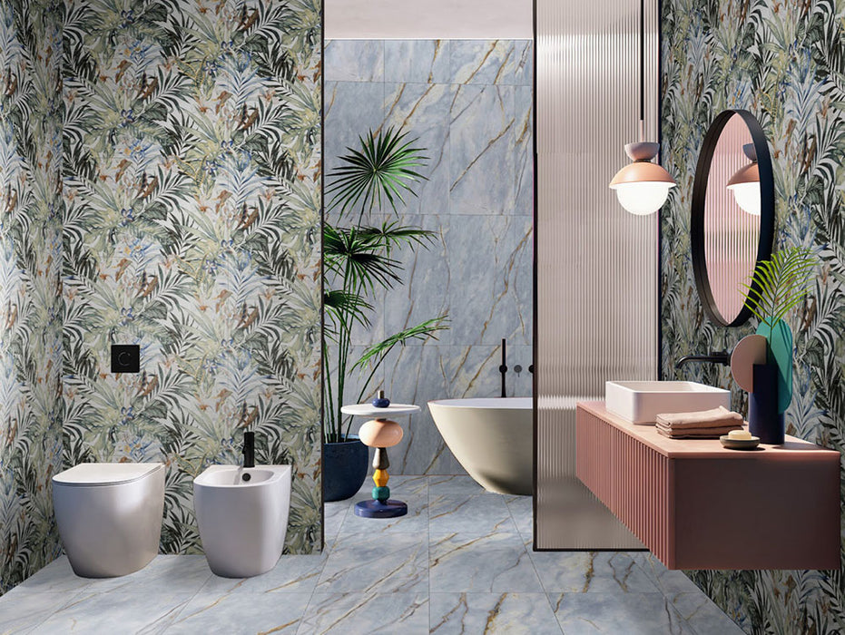 Bathroom interior featuring Lucca River Blue Matt 60 × 120cm porcelain wall and floor tiles, styled with a freestanding bath, statement veining, tropical accents, and contrasting textures for a bold, contemporary finish.