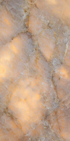 Flat lay of Lumen Precious Stone Amber 60 × 120cm polished porcelain tiles, showcasing rich amber, honey, and smoky stone-inspired tones with layered crystalline detailing, translucent mineral movement, fine natural veining, and a reflective high-gloss finish for a bold, luxurious statement surface.
