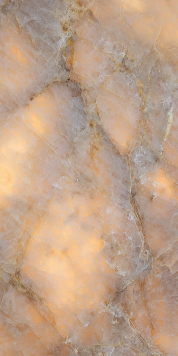 Flat lay of Lumen Precious Stone Amber 60 × 120cm polished porcelain tiles, showcasing rich amber, honey, and smoky stone-inspired tones with layered crystalline detailing, translucent mineral movement, fine natural veining, and a reflective high-gloss finish for a bold, luxurious statement surface.