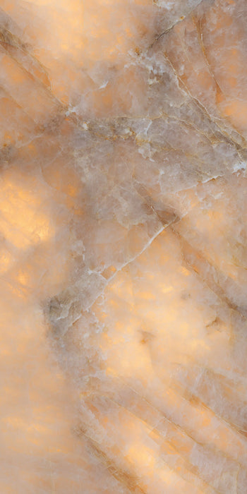 Flat lay of Lumen Precious Stone Amber 60 × 120cm polished porcelain tiles, showcasing rich amber, honey, and smoky stone-inspired tones with layered crystalline detailing, translucent mineral movement, fine natural veining, and a reflective high-gloss finish for a bold, luxurious statement surface.